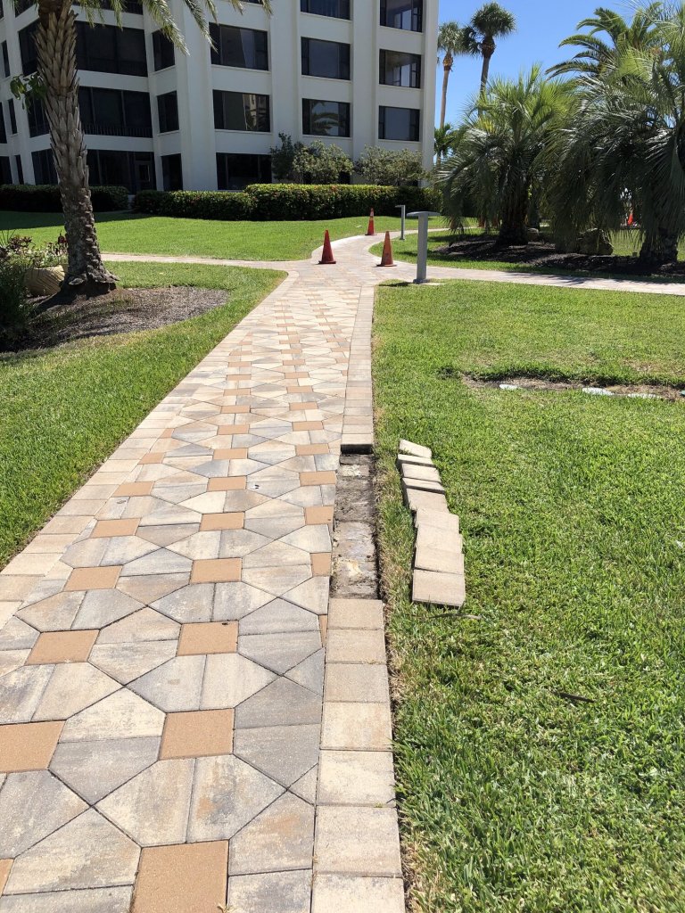 Commercial paver walkway repair in progress - Paver Design Center, Sarasota FL