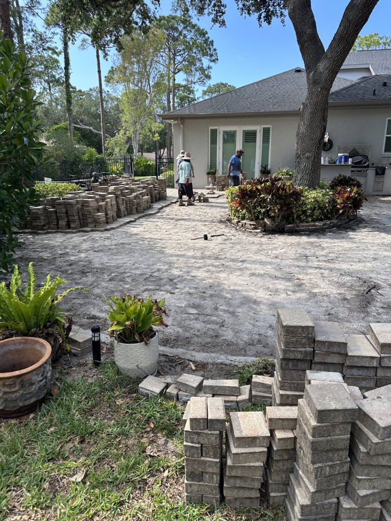 Backyard paver patio installation in progress - Paver Design Center, Sarasota FL